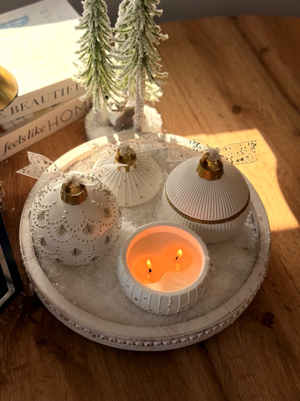 Close-up of the snowy, snowflake-inspired finish on the North Pole candle ornament