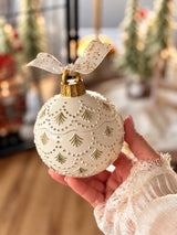North Pole Christmas candle ornament with evergreen tree details