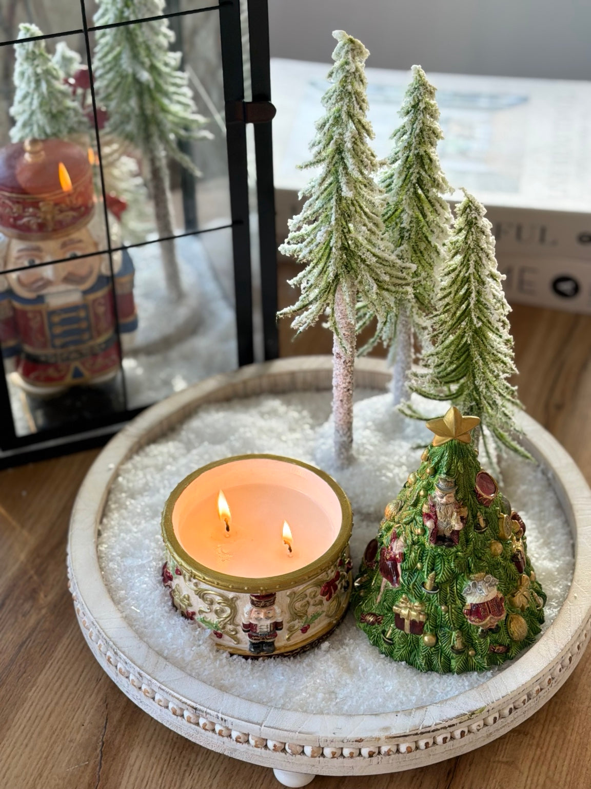 Nutcracker Christmas candle burning with two wicks