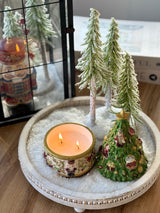 Nutcracker Christmas candle burning with two wicks