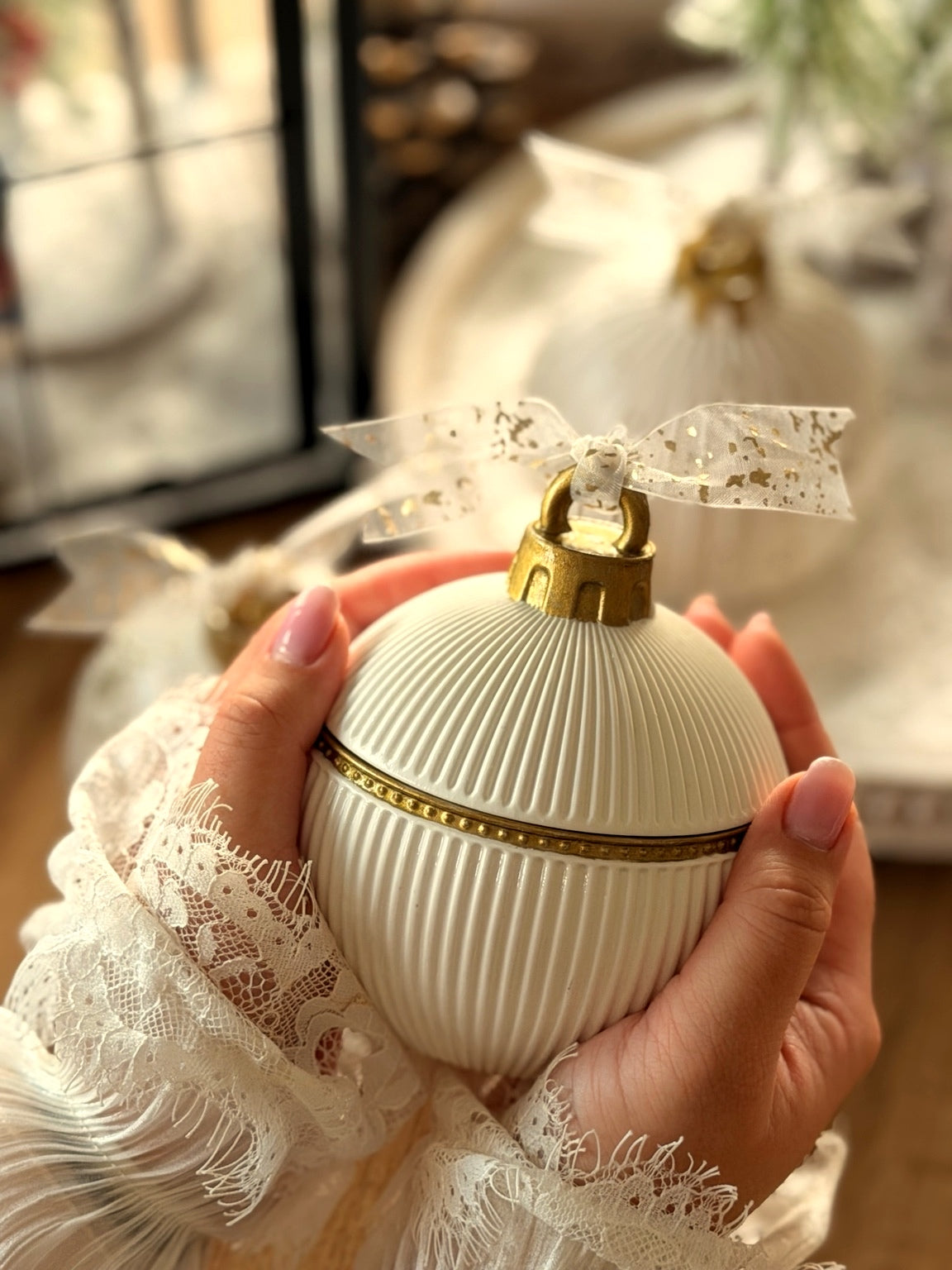 Handmade North Pole Christmas candle ornament styled for holiday decorating