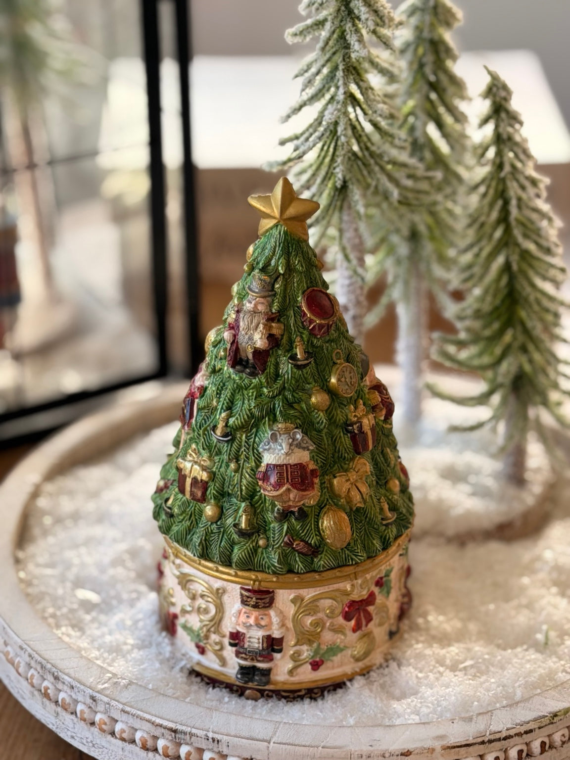 Nutcracker Christmas tree candle with its decorative removable lid