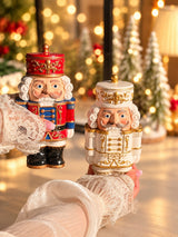 Nutcracker candles in festive red and pearl white with gold details