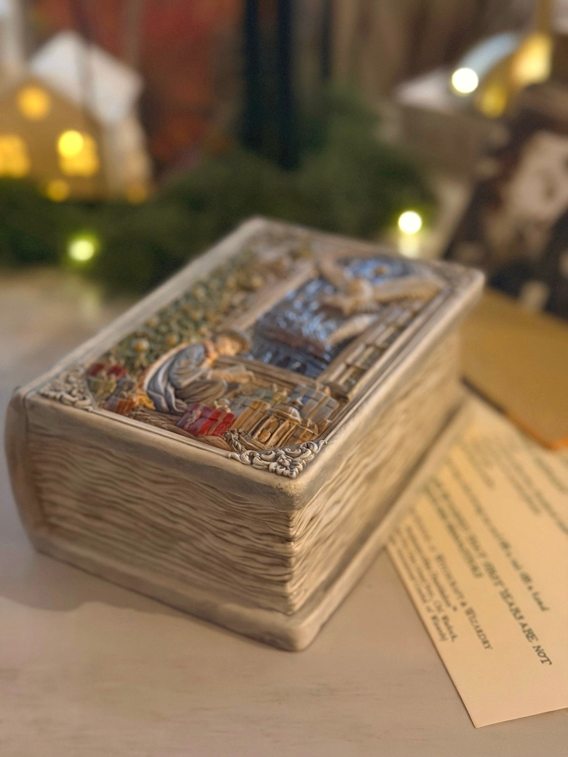 Close-up of the textured book pages and ornate lid of the Enchanted Book Candle