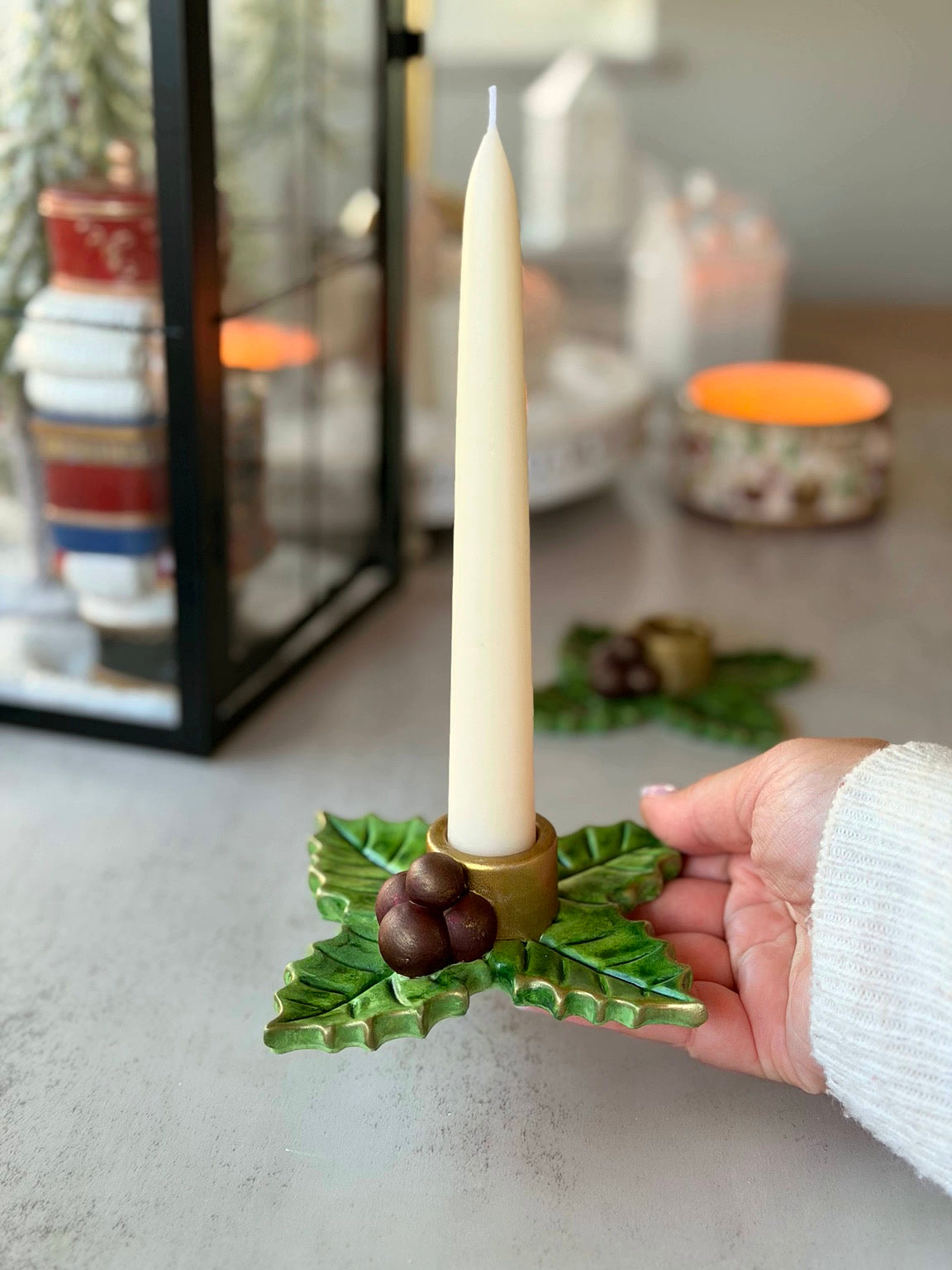 Holy Berry candle holder shown in hand for scale