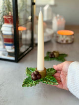 Holy Berry candle holder shown in hand for scale