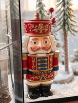 Close-up of the hand-painted Nutcracker Candle with ornate gold detailing