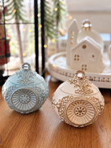 Romanov Secret handmade candle in blue and ivory with gold, showing both color options