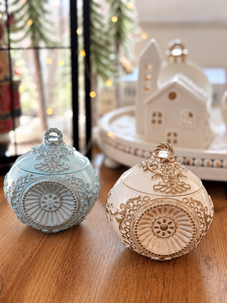 Romanov Secret handmade candle in blue and ivory with gold, showing both color options