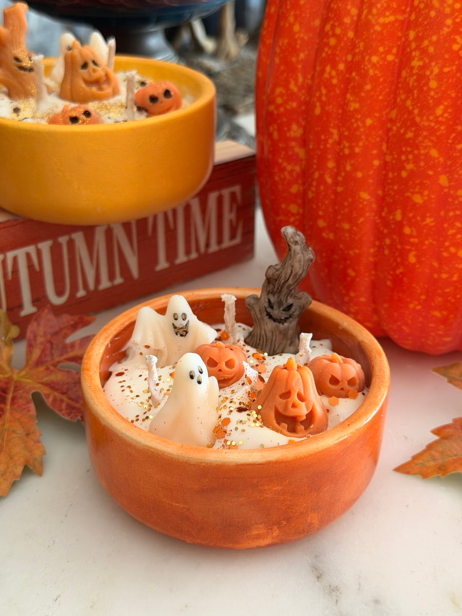 Spooky Candle in orange bowl topped with 3D soy wax ghosts, pumpkins and a spooky tree