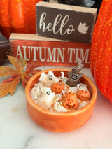 Spooky Candle with autumn decor and pumpkins