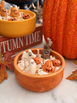Detail of the orange Spooky Candle topped with 3D soy wax Halloween figures